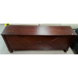 A mahogany box bench with hinged top and panelled front, length 130 cm