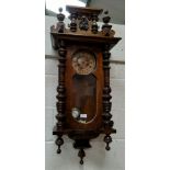 A 19th century Vienna style wall clock in walnut case, with striking spring driven movement