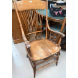 A light wood stick back arm chair; a light oak tv stand