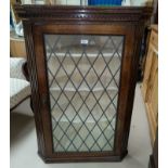 A 19th Century Oak corner cupboard with single leaded glazed door