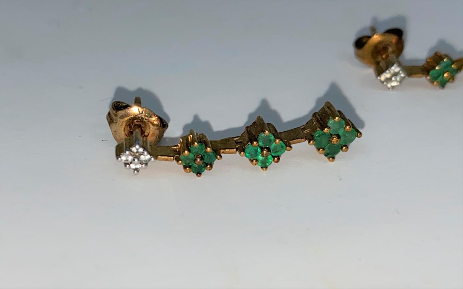 A pair of 9 carat hallmarked gold earrings, each set 4 small diamonds and 12 Emeralds 2.7 gms - Image 2 of 3