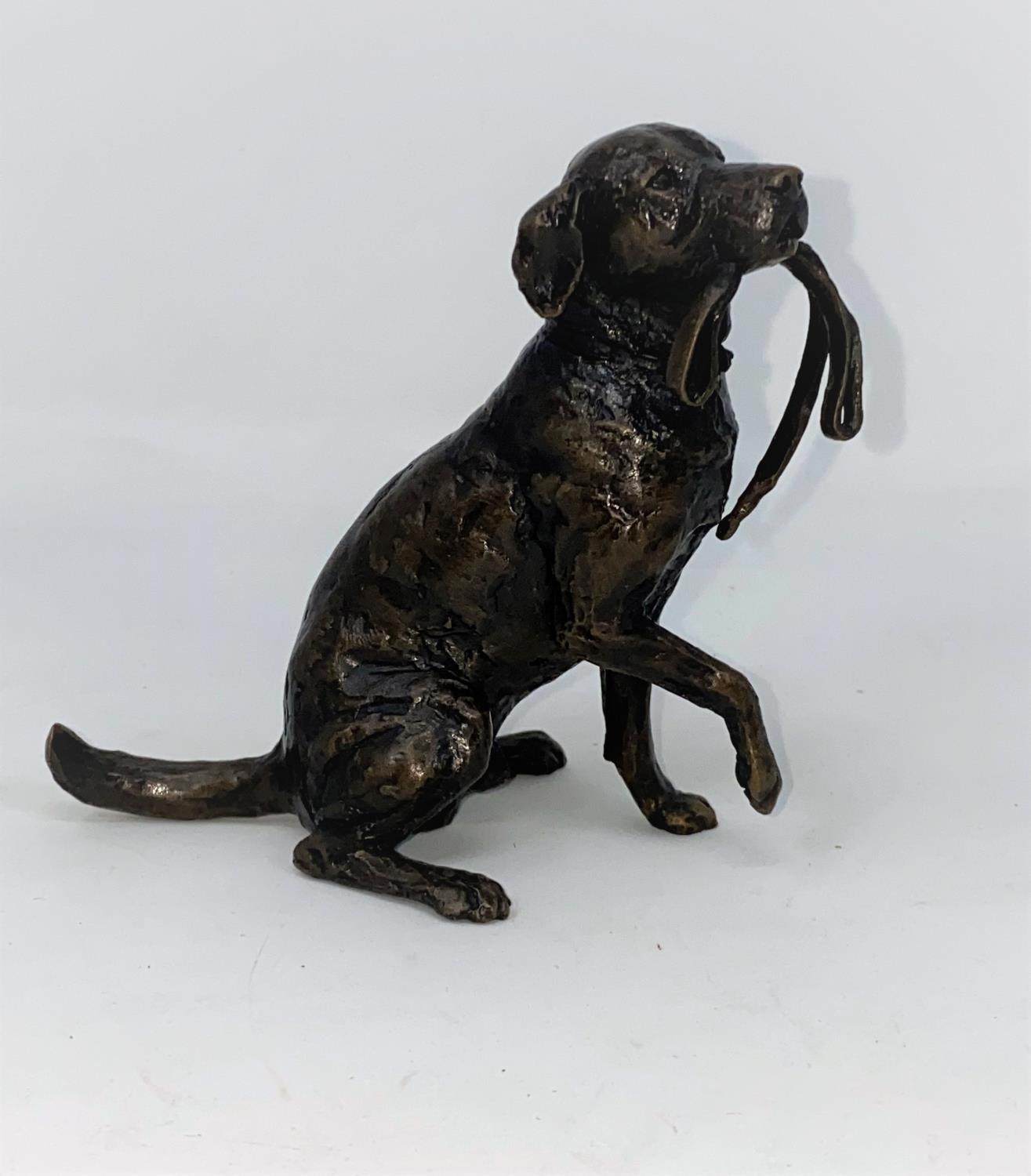 A modern limited edition bronze figure of a seated Labrador dog holding a lead in its mouth, 11cm,