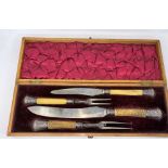 An inlaid oak cased carving set by Harrison Bros. & Howson, with horned handles and hallmarked