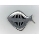 Georg Jensen: a silver brooch designed by Henning Koppel, in the form of a fish with black markings,