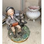 A Capodimonte group: boy and dog on bench; 2 vases