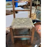 An Edwardian oval mahogany framed mirror, a child's chair and a stool