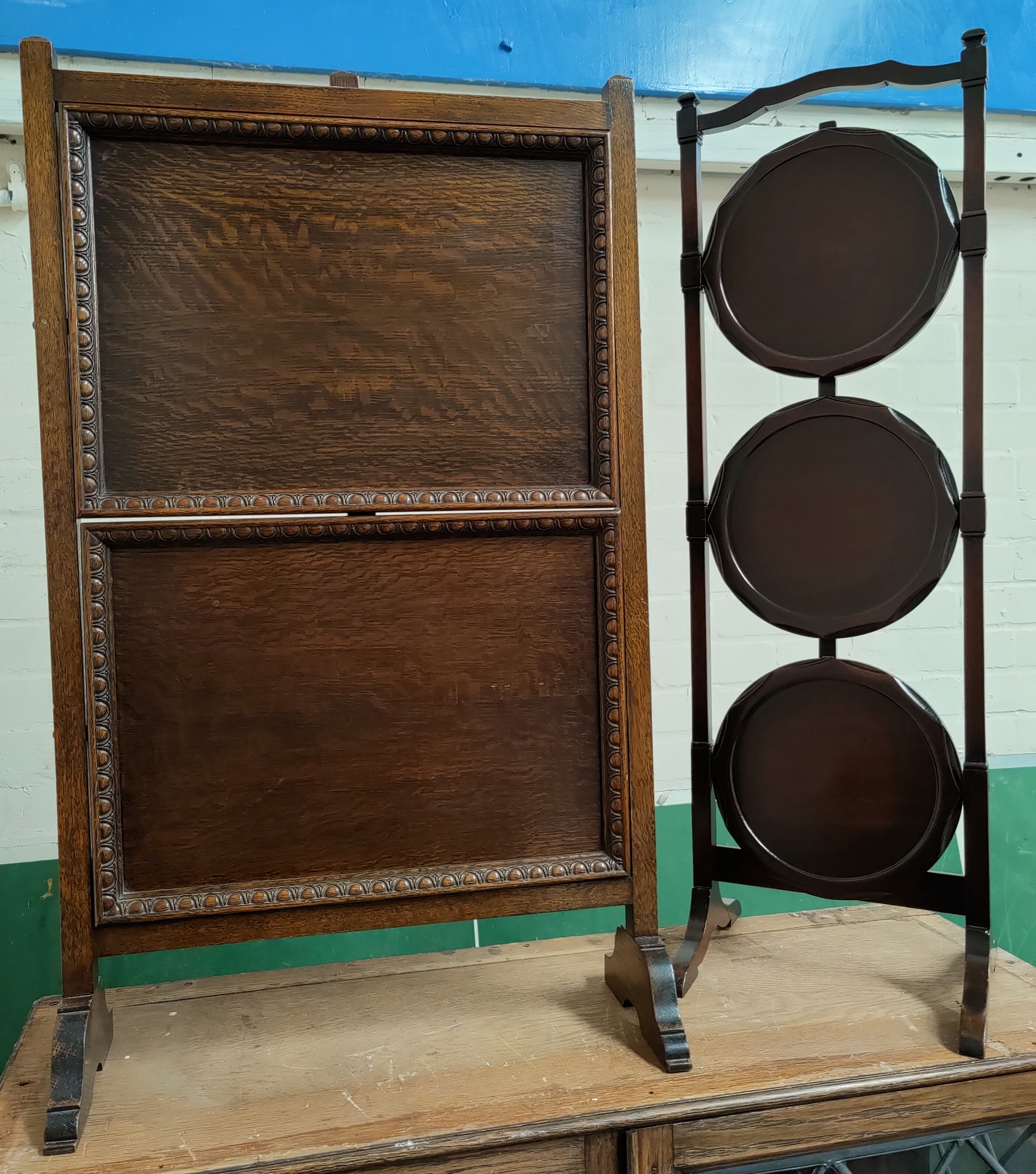 A mahogany 3 height folding cake stand and a 2 height oak folding cake stand.