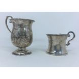 A hallmarked silver christening mug of chased baluster form, on circular foot, inscribed, Birmingham