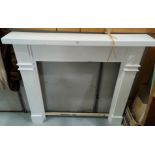 A painted wooden fireplace surround