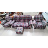 A three piece suite comprising: A three seater settee and two armchairs, upholstered in tartan