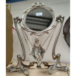 An Art Nouveau style silvered mirror with girl on swing