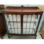 A 1920's mahogany 'D' front china cabinet with 2 doors