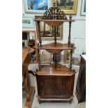 A burr walnut inlaid 'What Not' with three shelves and cupboard below, with turned columns and