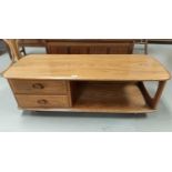 An Ercol light elm 2 height coffee table fitted 2 short drawers, 124 cm