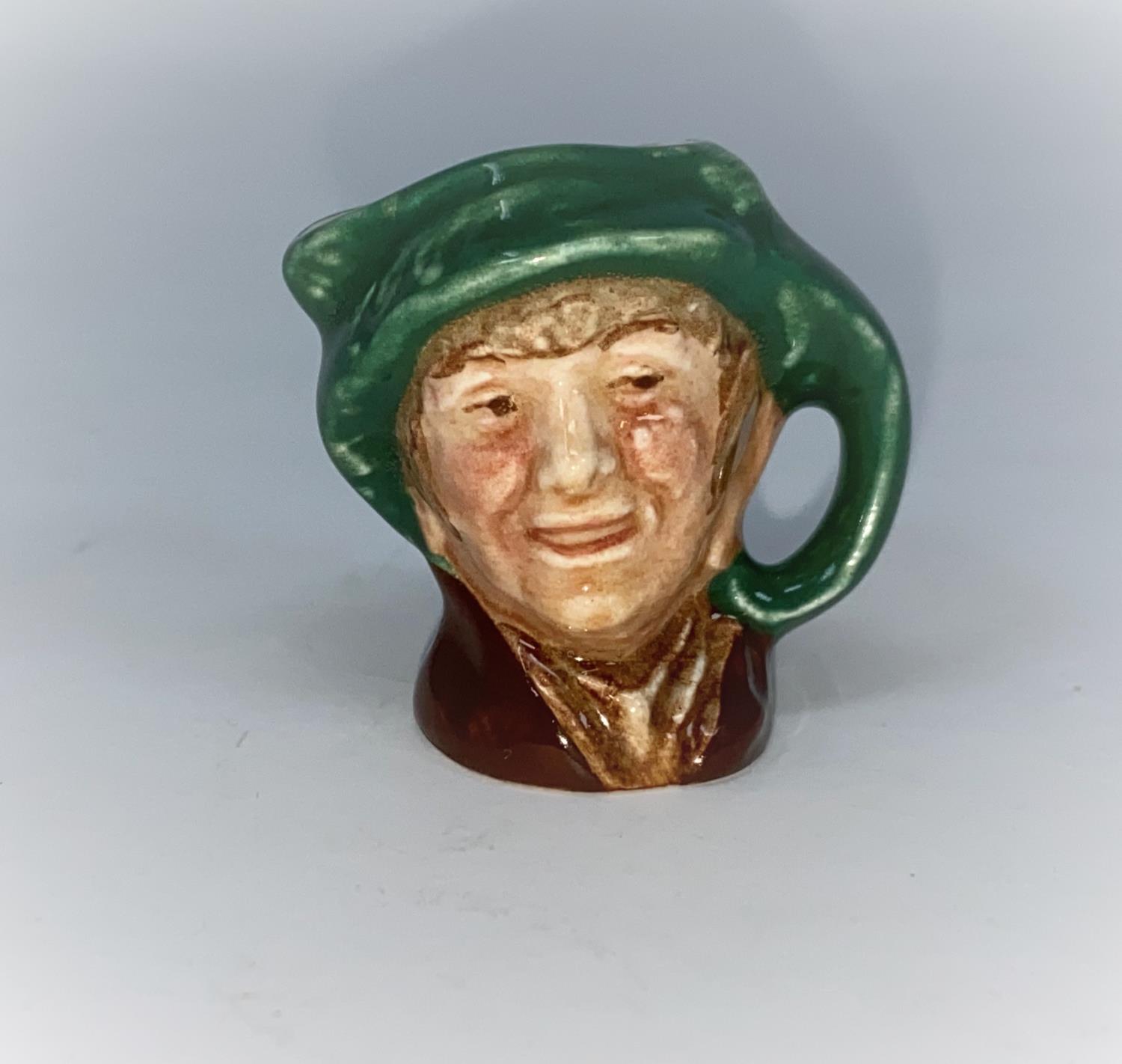 A miniature Royal Doulton character jug - Arriet