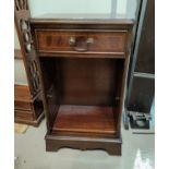 A mahogany reproduction dwarf bookcase with drawer and 2 shelves; a reproduction circular coffee