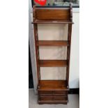 A mahogany reproduction 4 height wall shelf with drawers below