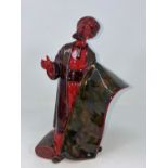 A Royal Doulton Flambe figure: The Carpet Seller HN 2776. Ht 24cm