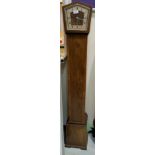 A 1930's crossbanded walnut Westminster chiming grandmother clock