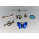 A Norwegian silver and blue enamel butterfly; a Star of David stamped375; a yellow metal necklace