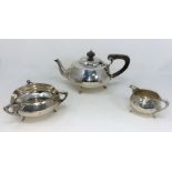 A three piece Arts & Crafts style hallmarked silver Tea Service by Charles Eley of London.