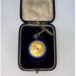 An early 20th century keyless open faced white metal fob watch with gilded blue enamel decoration,