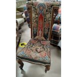 An Victorian oak panel tapestry nursing chair on Knurled feet (1 leg af)