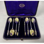 A hallmarked silver set of apostle top spoons and tongs, cased, London 1876, 3.6 oz