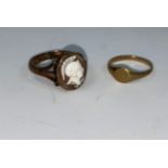 A Victorian yellow metal ring set with a cameo, classical warrior head, stamped '9ct'; a child's