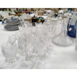 A Waterford crystal cut glass ship's decanter; two square decanters and a selection of cut glass