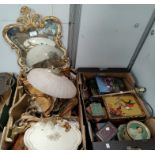 A gilt framed wall mirror, a large selection of gilt lacquer trays, a wall light fitting, decorative