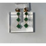 A pair of 9 carat hallmarked gold earrings, each set 4 small diamonds and 12 Emeralds 2.7 gms