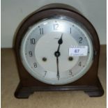 A 1930's Enfield Bakelite mantel clock with silvered dial