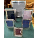 Three small modern hallmarked silver photo frames and 3 similar silver plated