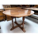 An Oak old charm extending oval dining table with one spare leaf and a set of six (4+2) oak panel