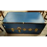 A large blue metal bound cabin trunk