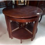 A mahogany nest of 4 tables comprising coffee table with circular top and 4 quarter tables; a 1960's