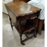 A oak drop leaf trolley on turned legs, with pie crust edges & single drawer; a circular