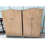 A 1950's bleached walnut 5 piece bedroom suite comprising double wardrobe, gents wardrobe, kidney