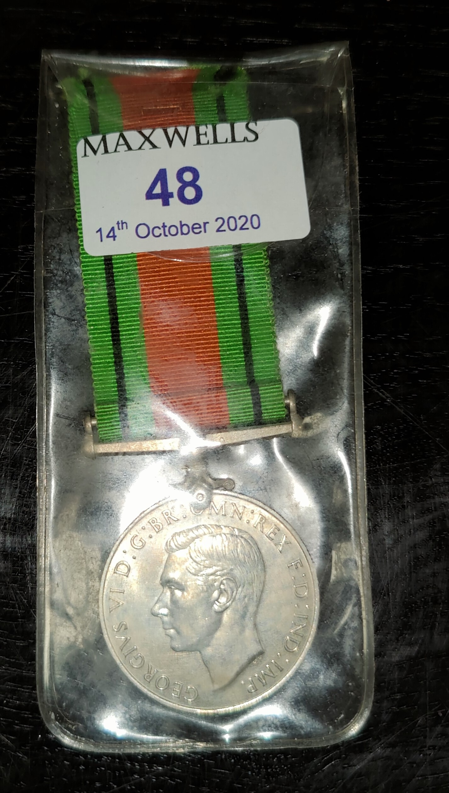 A WWII Defense Medal awarded to Alfred Hadfield Hallsworth.