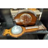 A 1930's chiming wall clock; a 1950's mantel clock by Smiths; a reproduction barometer in mahogany