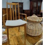 A G-Plan style pair of carver chairs; a tile top coffee table; an Alibaba basket