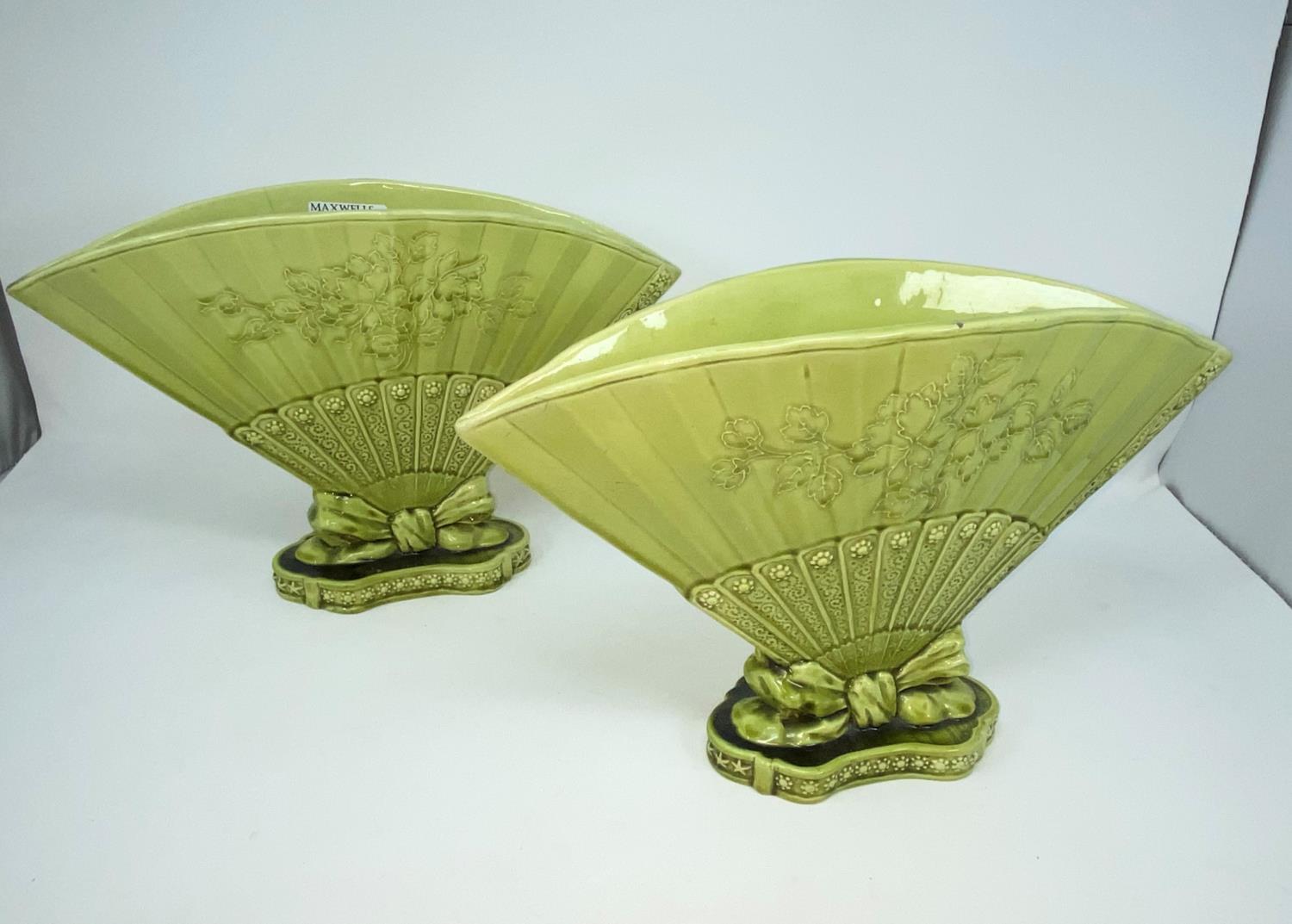 A pair of green glazed 'Burmantofts Faience' fan vases, width 32cm (one hairline cracks)