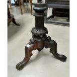 A Victorian circular piano stool with carved tripod base.