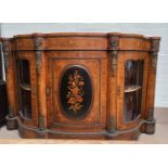 A 19th century Louis XV style serpentine font walnut credenza with extensive ormolu mounts and