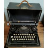 An early/mid 20th portable typewriter by Underwood, in case