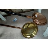 A brass and copper warming pan; another copper item