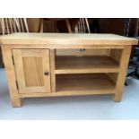 A modern light oak TV stand/coffee table