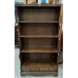 An oak reproduction 'waterfall' bookcase with 5 shelves and drawers below height 148 cm x width 77cm