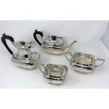 A hallmarked silver Georgian style 4 piece tea set of rounded rectangular form, on 4 ball feet,